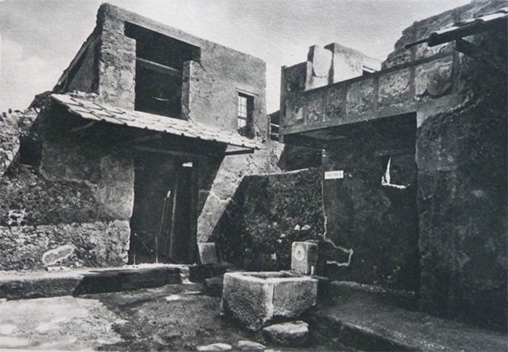 Altar at I.10.1, Pompeii. Old undated photograph. A wall blocked the Vicolo di Paquius Proculus, centre.