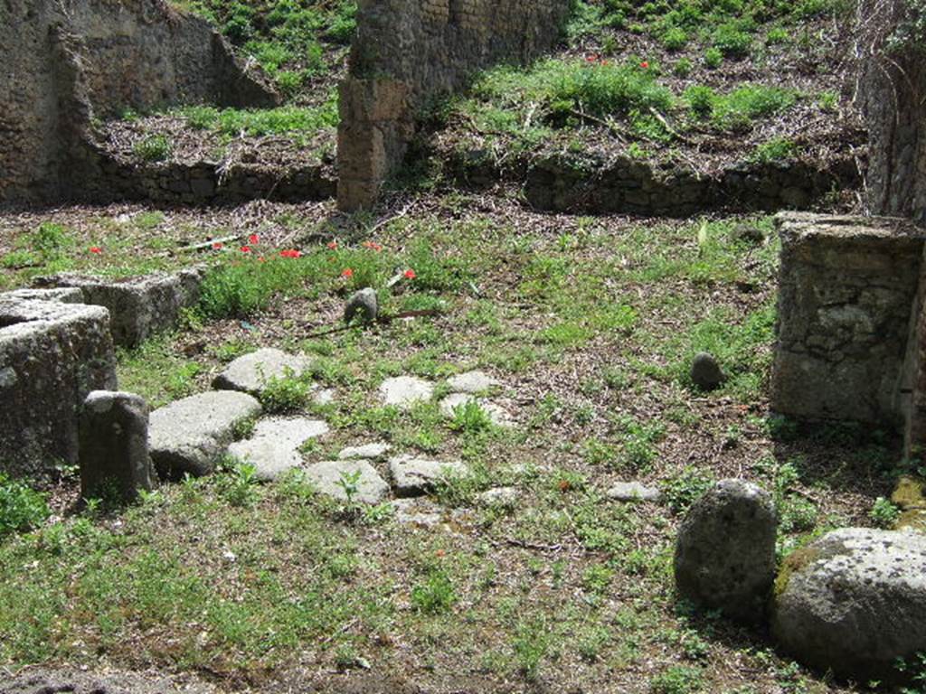 III.11.1 Pompeii, on left. Blocked/unexcavated roadway and street altar on north-east corner of III.10.6, on right. May 2005.