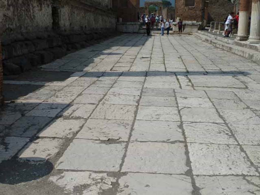 Arch of Nero. May 2010. Paving slabs on the east side of Temple of Jupiter. Traces of the foundations of the east and west sides of the demolished arch can be seen.