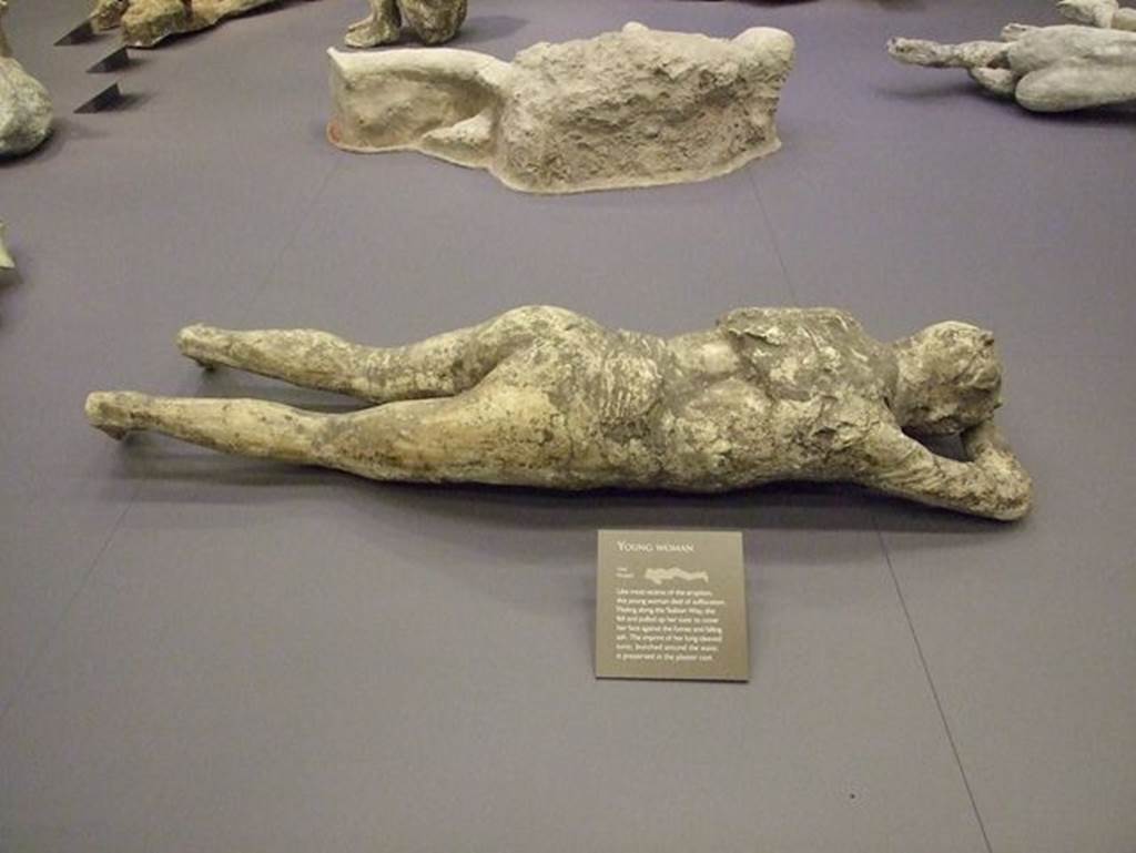 VII.7.29 Pompeii. May 2006. Victim number 10, plaster cast of body among items in storage area.