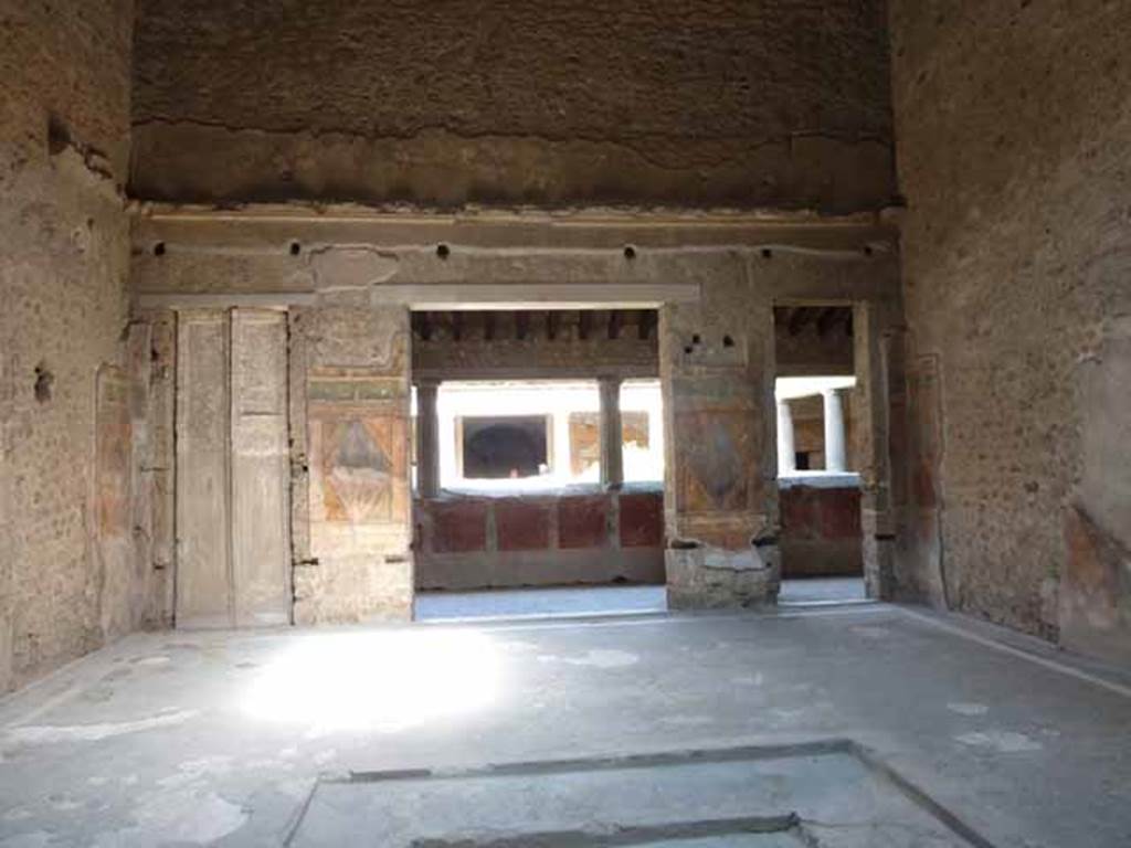 Villa of Mysteries, Pompeii. May 2010.  Room 64, east wall with cast of doorway, and large and small doorway to peristyle A.
