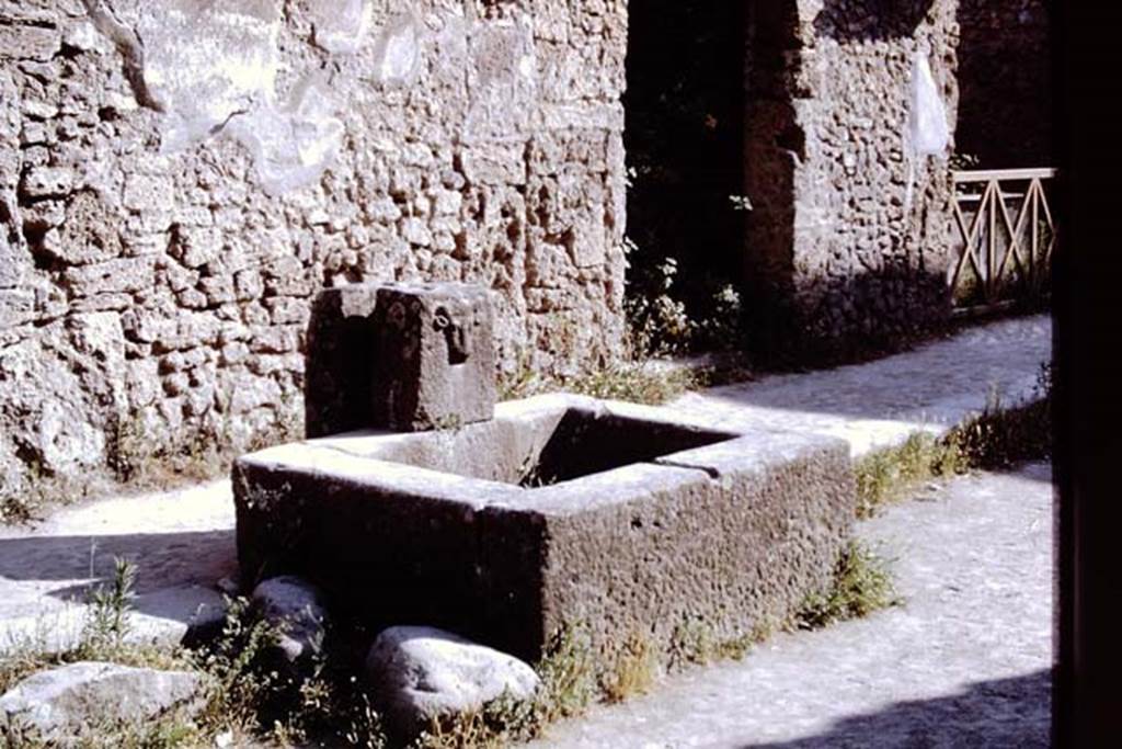 Fountain on Via dell’ Abbondanza between II.1.2 and II.1.3. Pompeii, 1968. 
Photo by Stanley A. Jashemski.
Source: The Wilhelmina and Stanley A. Jashemski archive in the University of Maryland Library, Special Collections (See collection page) and made available under the Creative Commons Attribution-Non Commercial License v.4. See Licence and use details.
J68f0305
