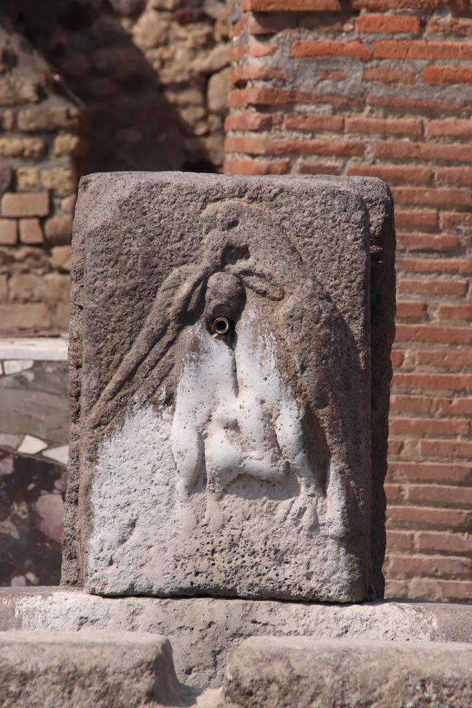 Fountain outside VI.3.20 September 2019. Relief on pilaster of fountain of an eagle holding a hare in its talons.
Looking north. Photo courtesy of Klaus Heese.
