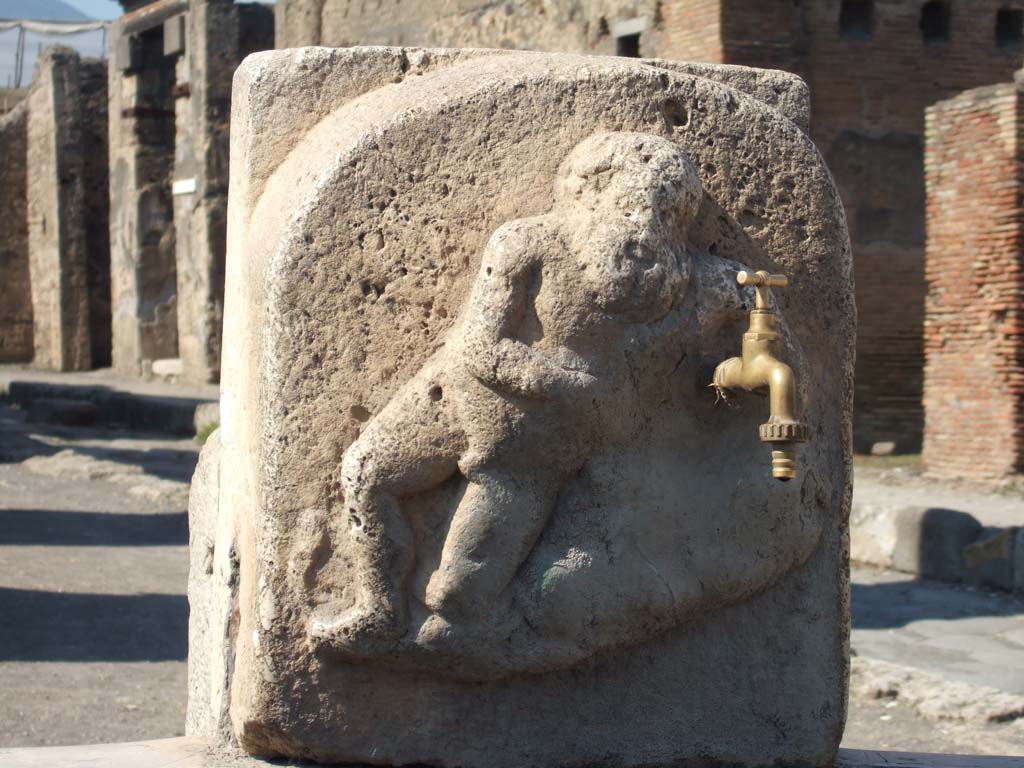 Fountain outside VI.14.17, Pompeii. October 2020. Detail of marble relief of Silenus on pilaster of fountain.
Photo courtesy of Klaus Heese.
