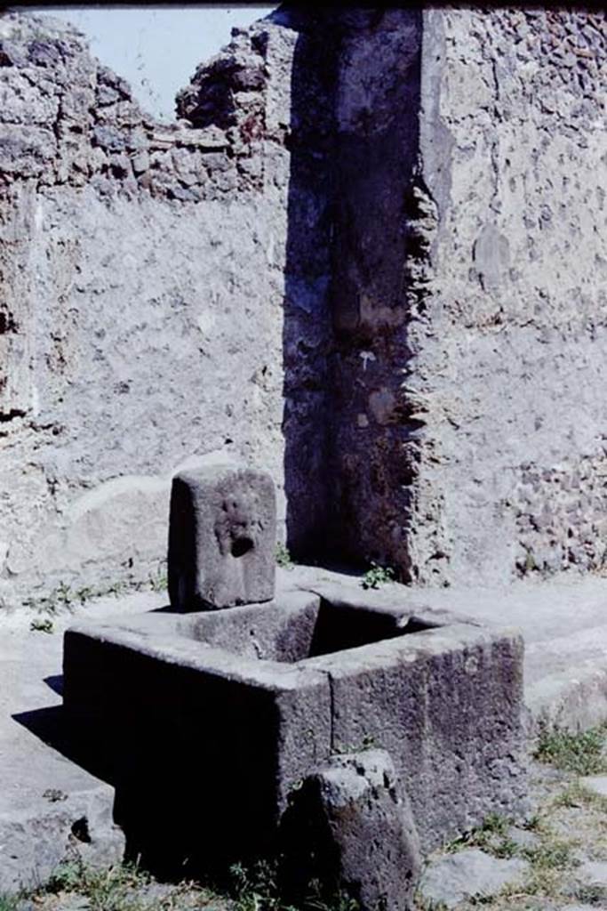 Looking south-east across fountain outside VI.16.28 on Vicolo dei Vettii, Pompeii. 1968. 
Photo by Stanley A. Jashemski.
Source: The Wilhelmina and Stanley A. Jashemski archive in the University of Maryland Library, Special Collections (See collection page) and made available under the Creative Commons Attribution-Non Commercial License v.4. See Licence and use details.
J68f1960
