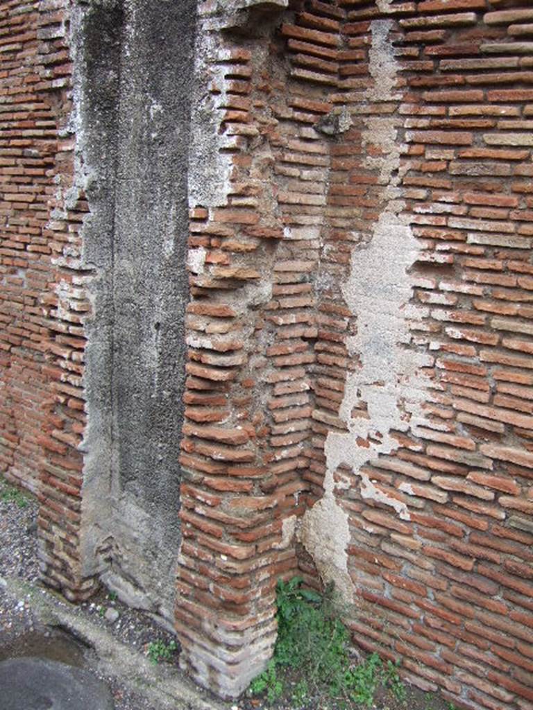 VII.5.8 Pompeii.  Side wall with remains of water tower. 