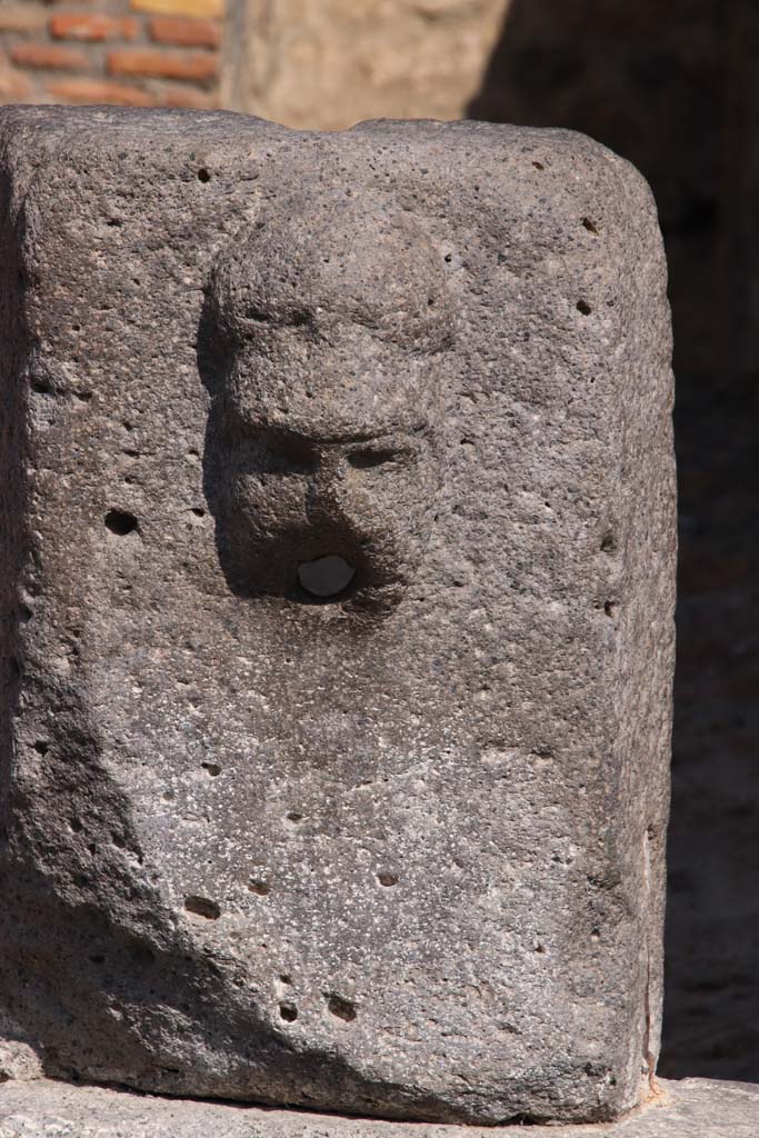 Fountain outside VII.14.13 and VII.14.14 on north side of Via dell’Abbondanza. September 2019. 
Head with helmet, possibly a relief of Minerva.  Photo courtesy of Klaus Heese.
