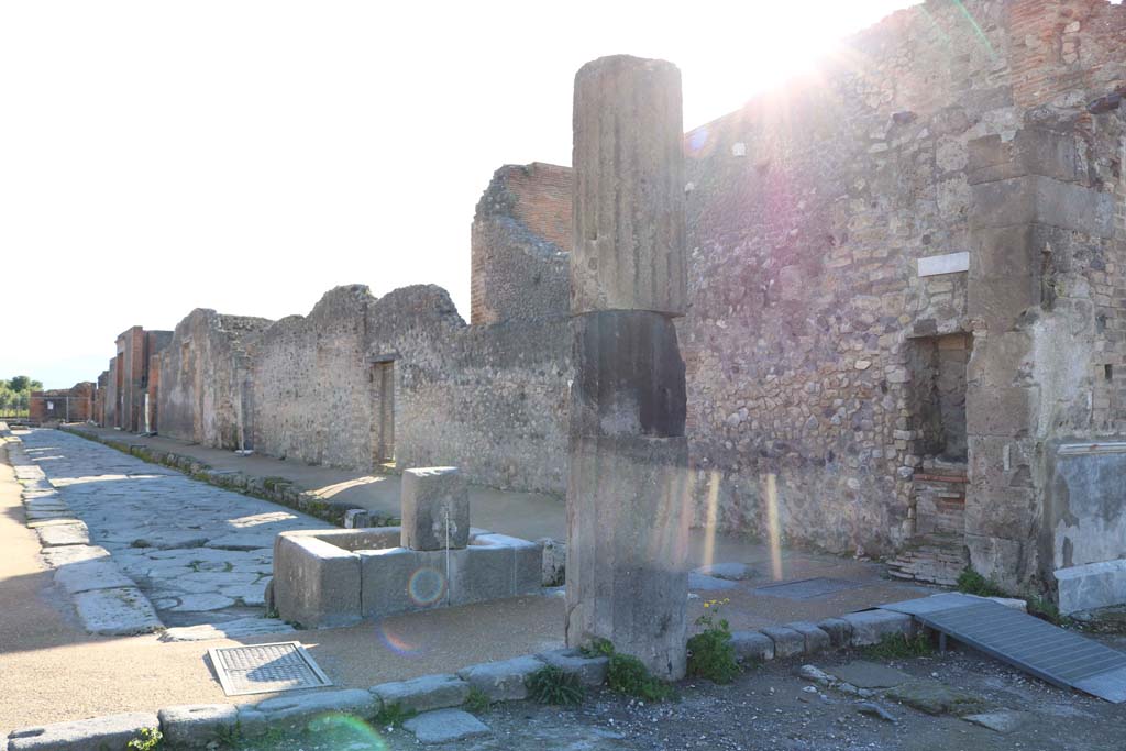 Fountain outside VIII.2.11 on Via delle Scuole, Pompeii. December 2018. 
Looking south past rear of fountain along west side of VIII.2, from Forum. Photo courtesy of Aude Durand.


