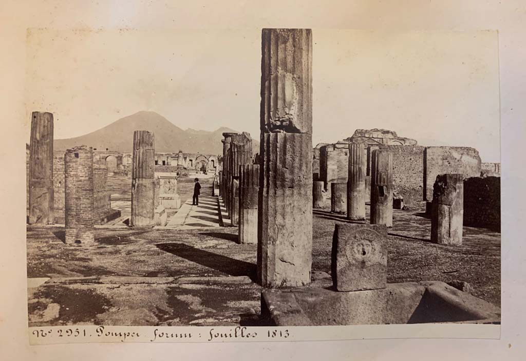 Fountain outside VIII.2.11, Pompeii. 
From an album of Michele Amodio dated 1874, entitled “Pompei, destroyed on 23 November 79, discovered in 1745”. 
Looking north towards Forum from fountain at end of Via delle Scuole. Photo courtesy of Rick Bauer.

