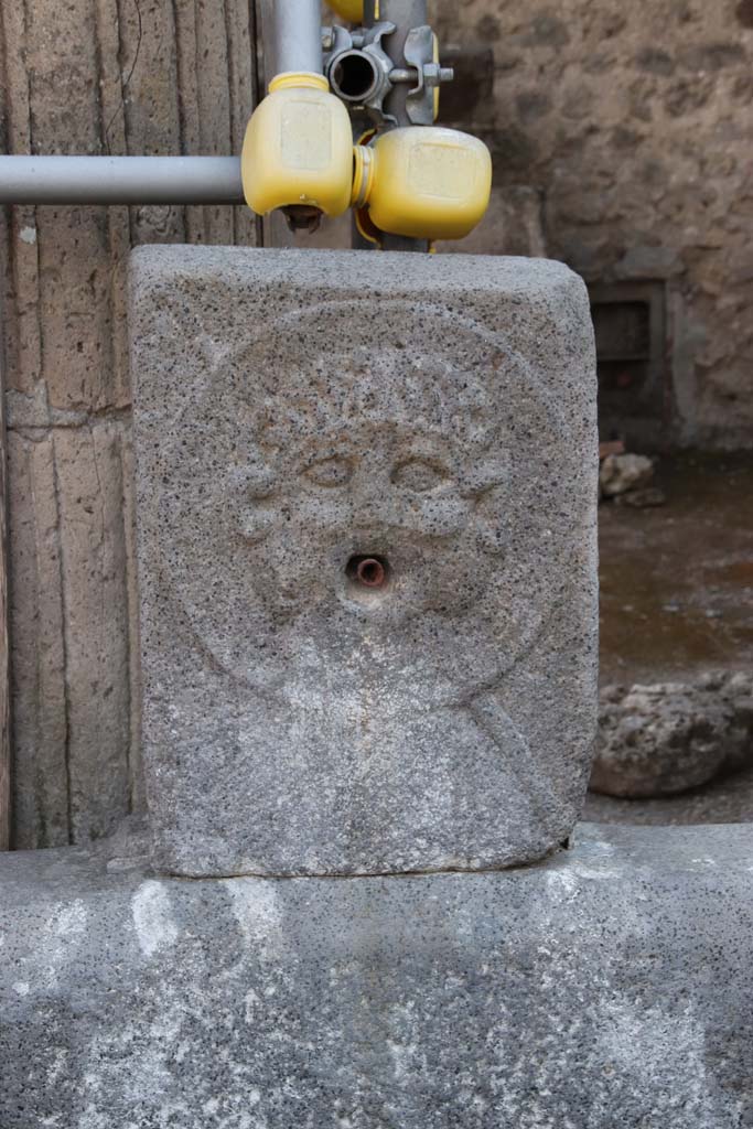 Fountain outside VIII.7.30. September 2021. 
Relief of medallion with Triton on pilaster. Photo courtesy of Klaus Heese.


