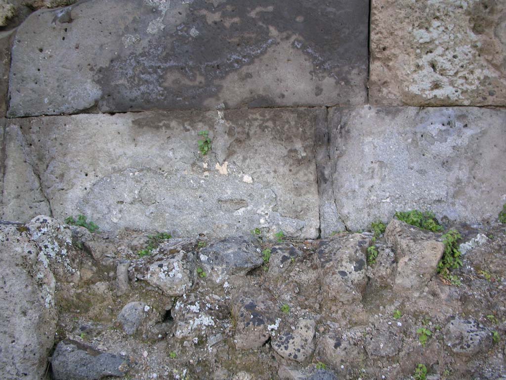 Pompeii Vesuvian Gate. May 2006. West side. Cippus used as kerbstone in north-west corner of area C.