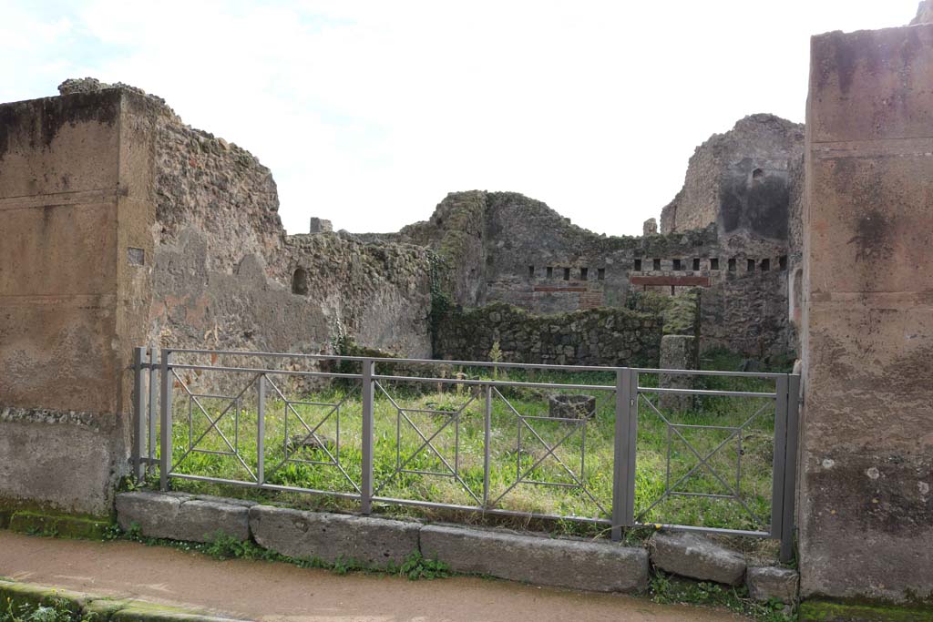 VII.12.11, Pompeii. December 2018. Looking south to entrance doorway on Via degli Augustali. Photo courtesy of Aude Durand.