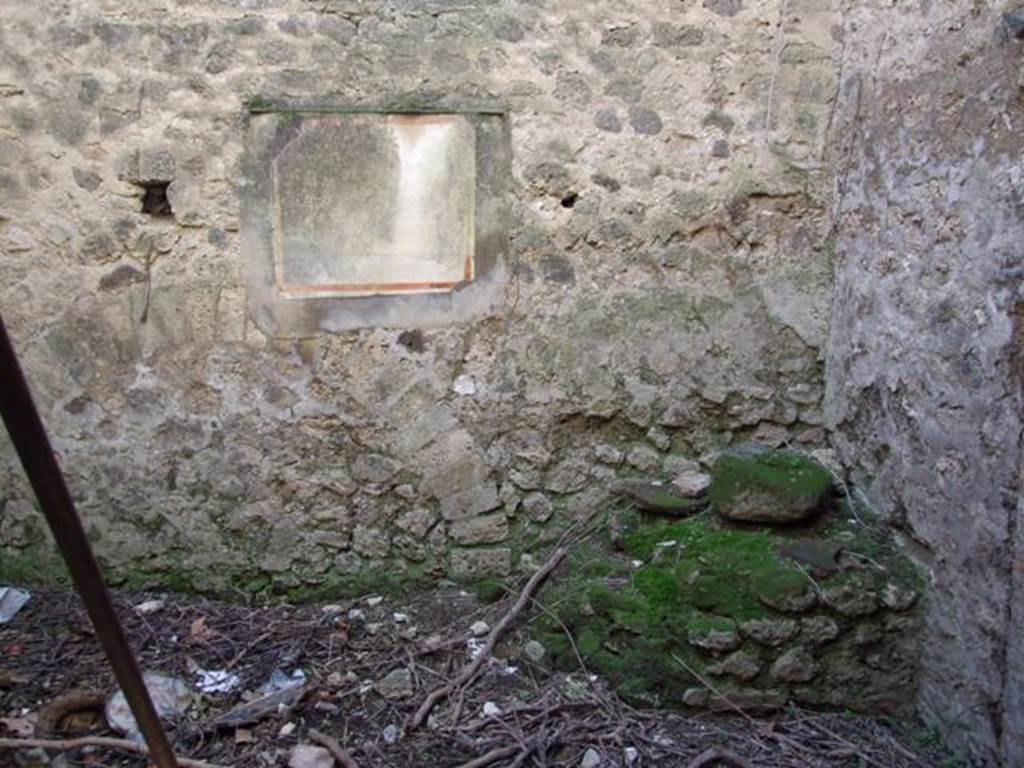 VIII.5.39 Pompeii. March 2009. Room 3, south wall of kitchen, with bench and remains of lararium painting.
In the south-east corner, on the left of the photo, would have been the latrine.
See Hobson, B., 2009. Pompeii, Latrines and Down Pipes. Oxford, Hadrian Books: (p.466)  


