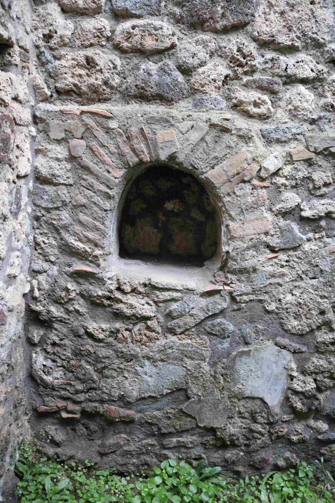 IX.3.13 Pompeii. December 2018. Kitchen, niche on north wall. Photo courtesy of Aude Durand.
According to Boyce, in the kitchen behind the shop, in the north wall is an arched niche (h.0.45, w.0.45, d.0.20, h. above floor 1.05). 
See Boyce G. K., 1937. Corpus of the Lararia of Pompeii. Rome: MAAR 14. (p.84, no.412).
