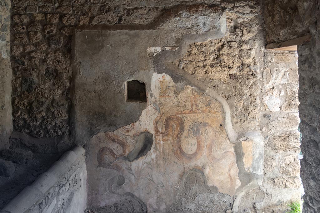 V.2.h Pompeii. October 2023. Kitchen ‘p’, looking towards south wall with lararium. Photo courtesy of Johannes Eber.