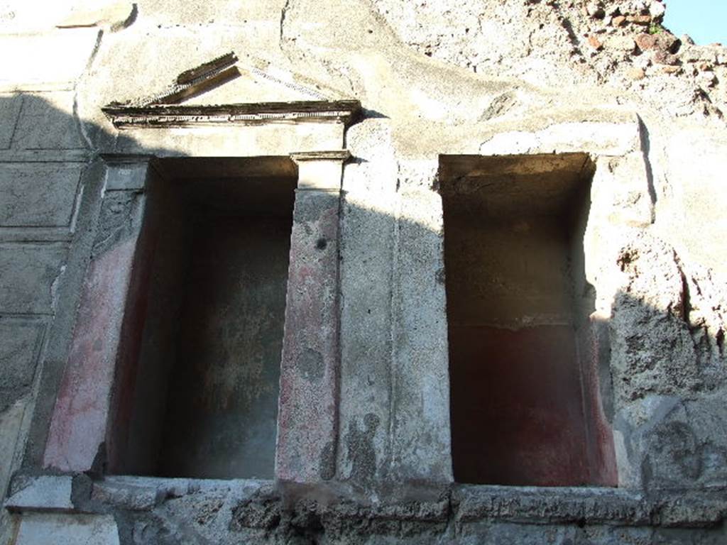 VI.12.2 Pompeii. December 2006. Rear north wall with 2 large niches with aedicula facades.  At least one of these niches was a Lararium.   See Boyce G. K., 1937. Corpus of the Lararia of Pompeii. Rome: MAAR 14.  (p51, No.189A).
