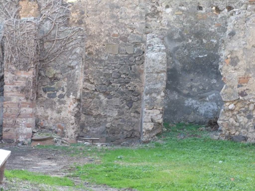 VI.15.18 Pompeii. December 2007. West side with doorways to rear rooms.
According to Jashemski, the site was already badly damaged at the time of the eruption. At the left rear (south-west) is a small area that Sogliano identified as a small garden. Mau thought the site was too badly damaged to be interpreted. See Jashemski, W. F., 1993. The Gardens of Pompeii, Volume II: Appendices. New York: Caratzas. (p.158)
