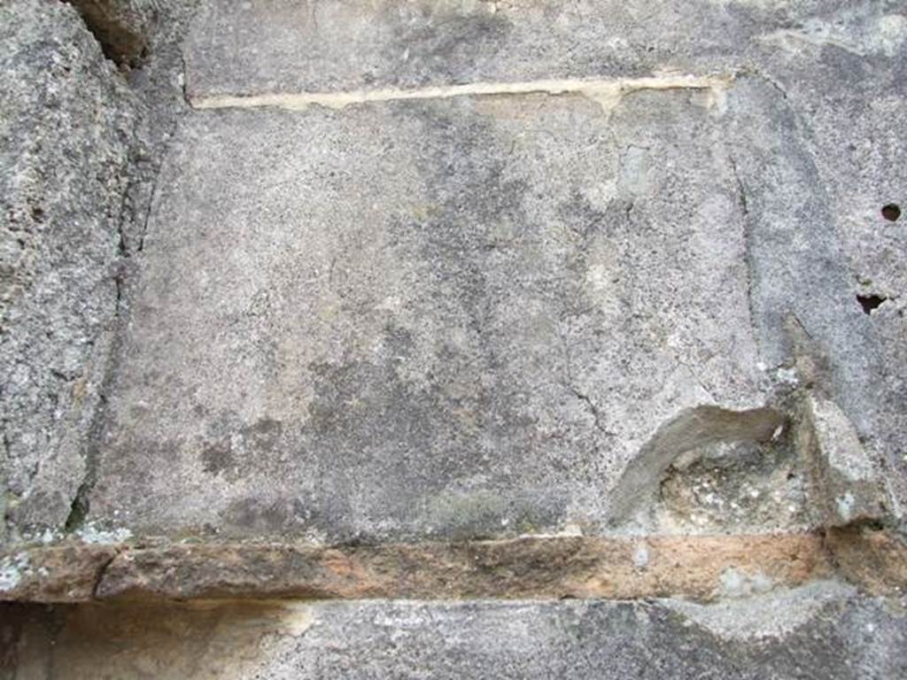 VI.16.27 Pompeii. March 2009. Room B, detail of remains of broken tiles in recess in south wall.