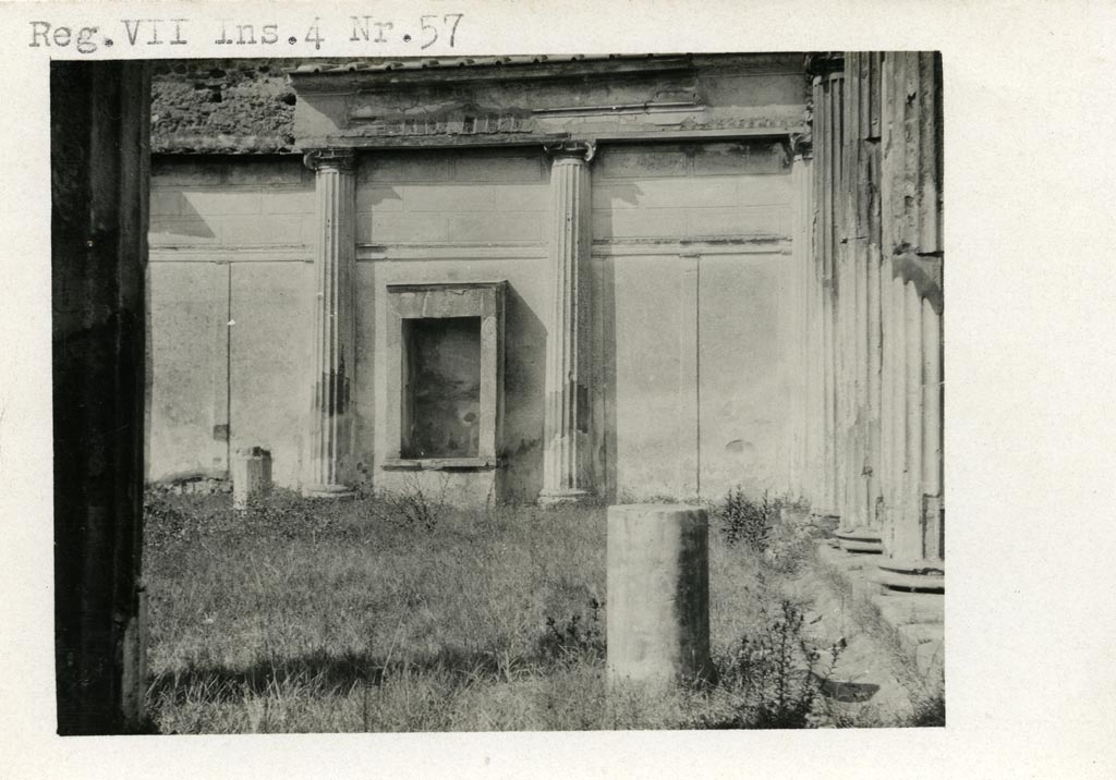 VII.4.57 Pompeii. Pre-1937-39. Aedicula Lararium against west wall of peristyle.
Photo courtesy of American Academy in Rome, Photographic Archive. Warsher collection no. 1773.
According to Boyce, the row of columns forming the western portico of the peristyle is built into the wall.
A rectangular niche (h.1.75, w.0.90, d.0.60) bordered by solid walls stands upon a masonry base (h.0.65).
See Boyce G. K., 1937. Corpus of the Lararia of Pompeii. Rome: MAAR 14. (p.66, no.282, and Pl.35,3).

