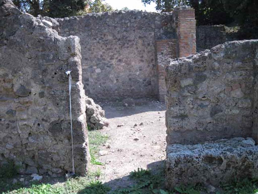 I.1.5 Pompeii. September 2010. Doorway in south wall of shop-room, leading into I.1.4. Photo courtesy of Drew Baker.
