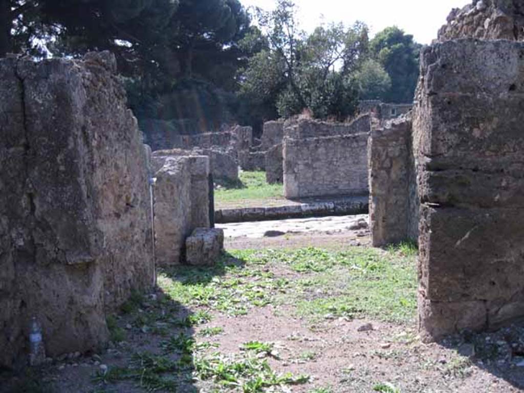 I.1.5 Pompeii. September 2010. Looking west from rear room, towards shop-room and Via Stabiana. Photo courtesy of Drew Baker.
