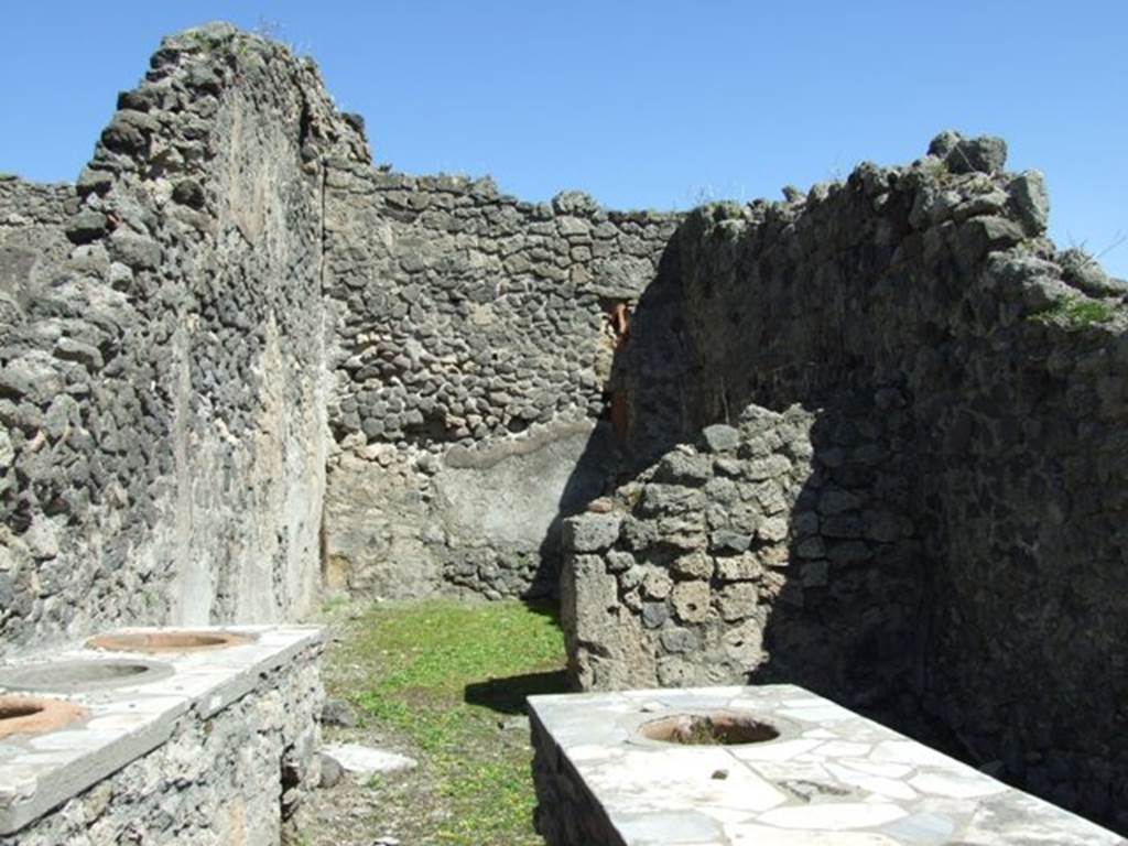 I.2.8 Pompeii.  March 2009.    Looking east to rear room.