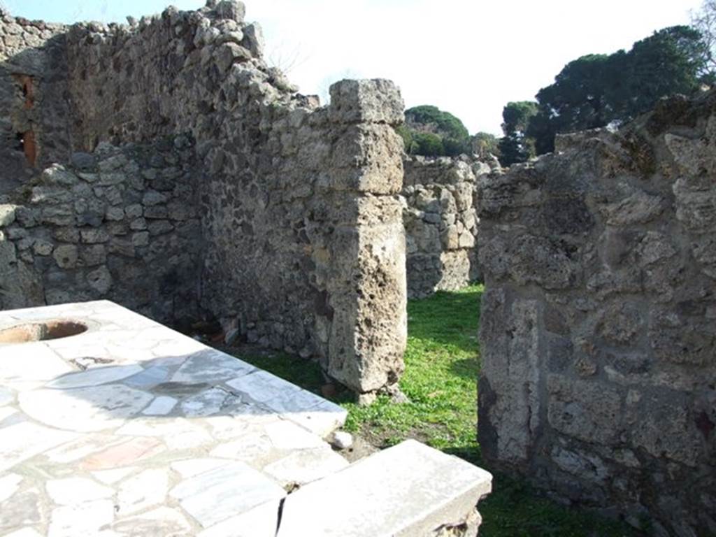 I.2.8 Pompeii.  December 2007.  South wall with doorway linking to I.2.7..

.