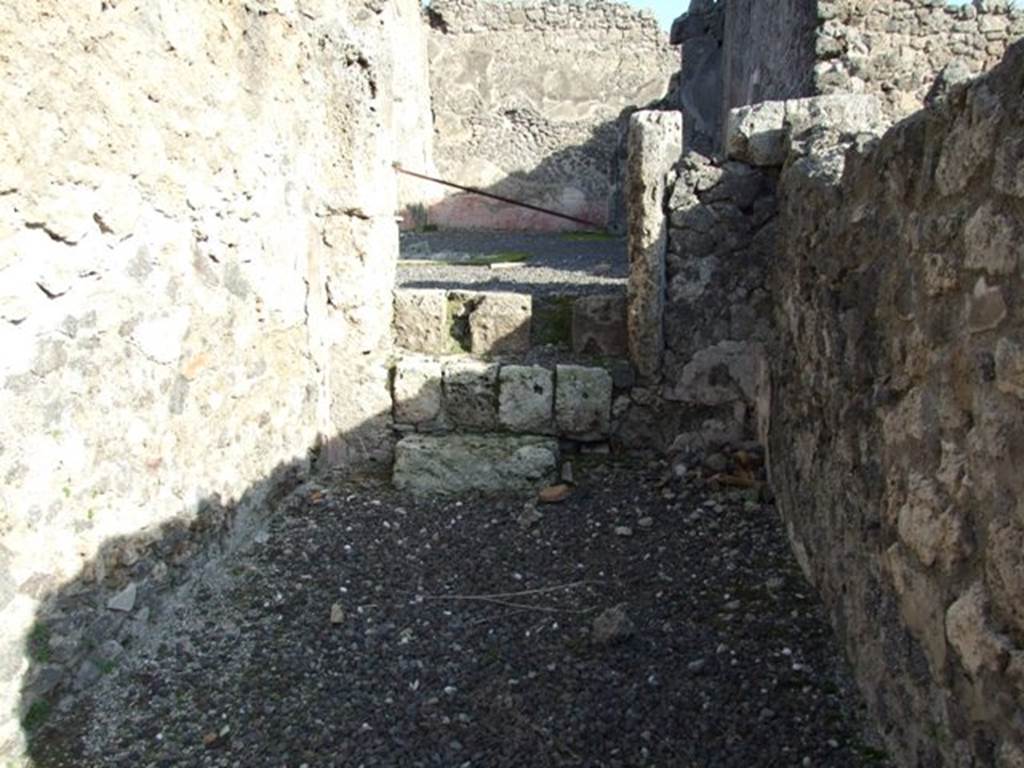 I.2.9 Pompeii. December 2007. Narrow shop connected by three steps in the east wall to the atrium of I.2.10.

