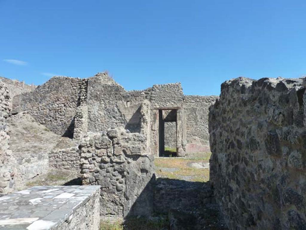 I.2.11 Pompeii. September 2015. Looking east along south wall of bar-room. 

