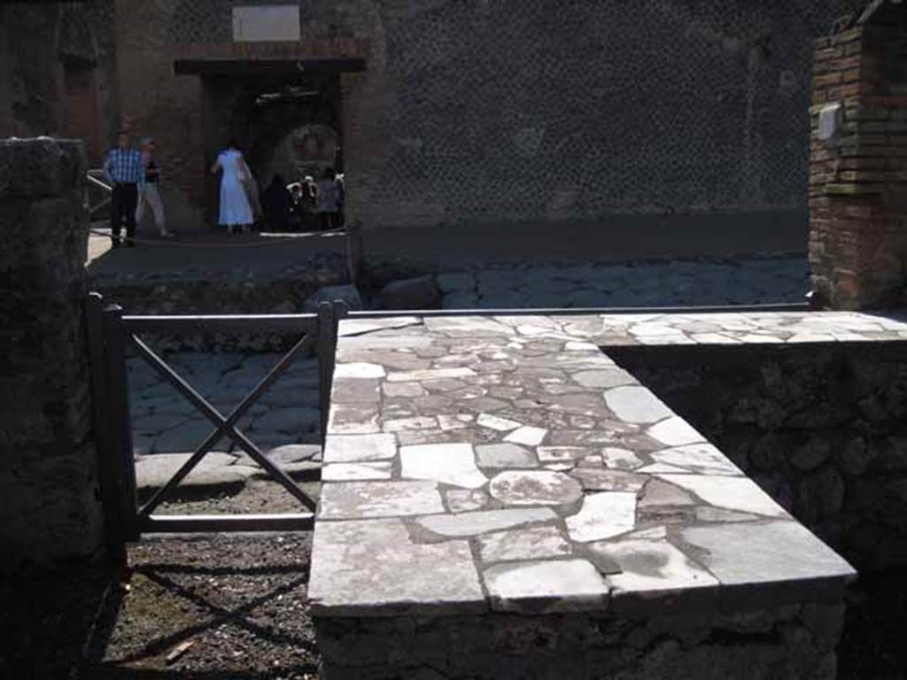 I.2.11 Pompeii. September 2010. Looking west from bar, towards entrance and Via Stabiana. Photo courtesy of Drew Baker.

