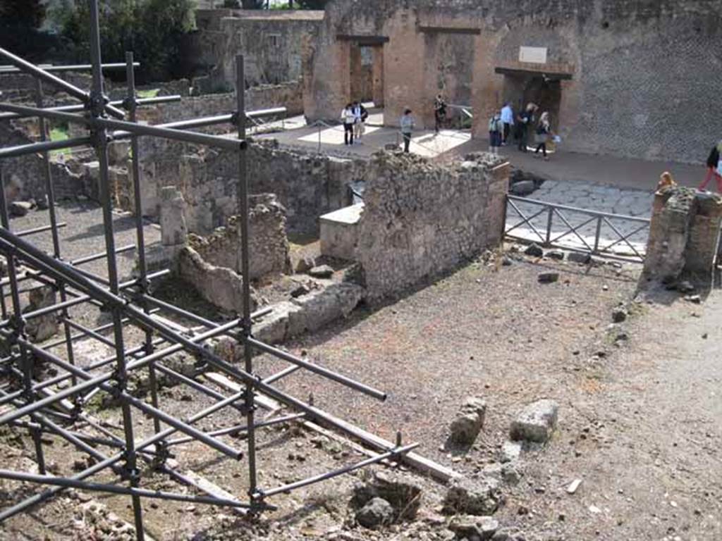 I.2.15 Pompeii. September 2010. Looking south-west from end of corridor on top of collapse. Photo courtesy of Drew Baker.
According to Garcia y Garcia, all the west part of the dwelling was completely destroyed in 1943. The bomb demolished the upper floor, leaving the cistern below uncovered and visible. See Garcia y Garcia, L., 2006. Danni di guerra a Pompei. Rome: LErma di Bretschneider.  (p.37)
