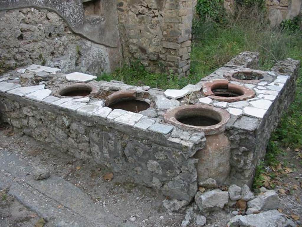 I.2.18 Pompeii. May 2003. Counter with urns. Photo courtesy of Nicolas Monteix.

