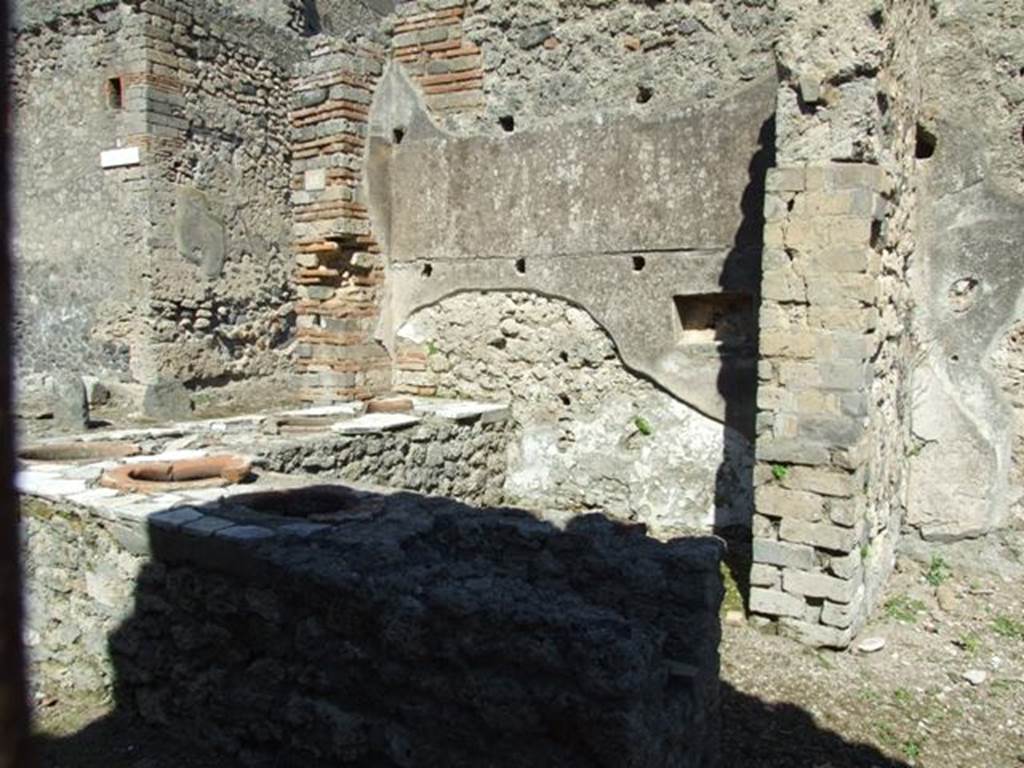 I.2.18 Pompeii.  March 2009.  Counter with urns and hearth, taken from doorway into I.2.17.