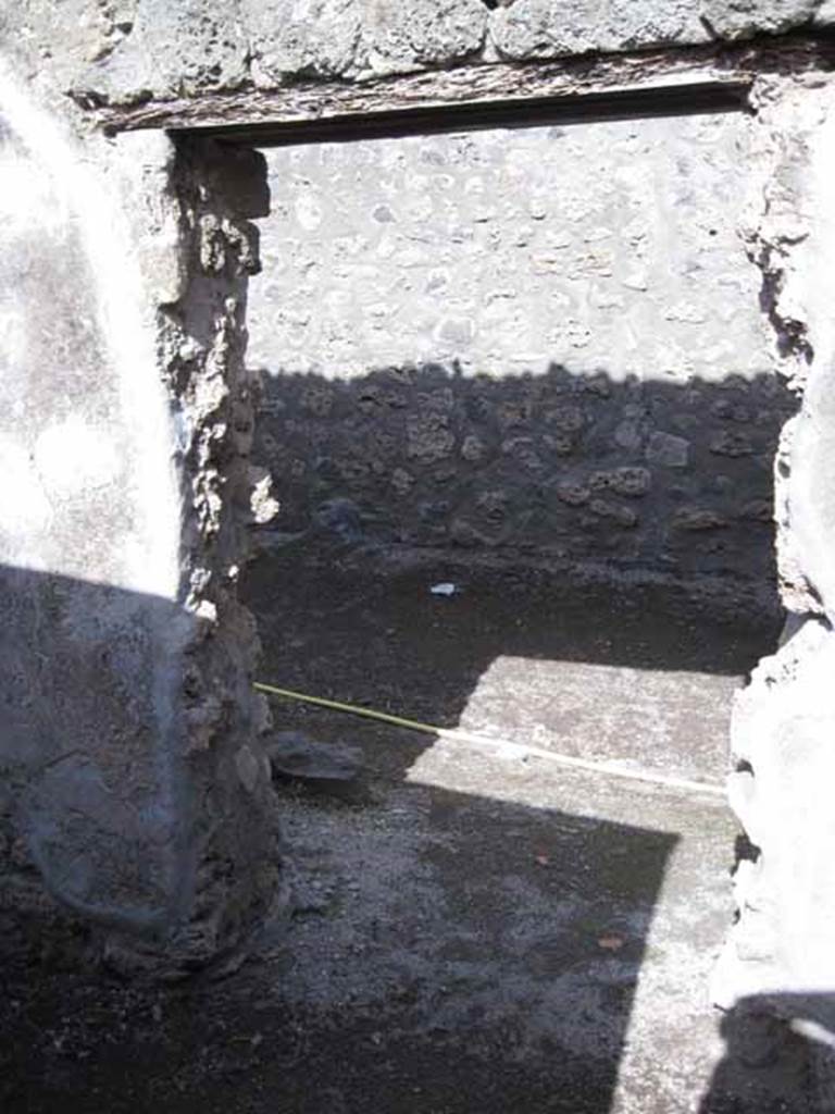 I.2.19 Pompeii. September 2010. Looking east from interior of doorway at 1.2.19, at rear of bar, into Vicolo del Citarista. Photo courtesy of Drew Baker.

