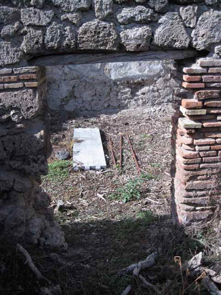 I.2.20 Pompeii. September 2010. Looking north from kitchen area, through doorway into small atrium. Photo courtesy of Drew Baker.
