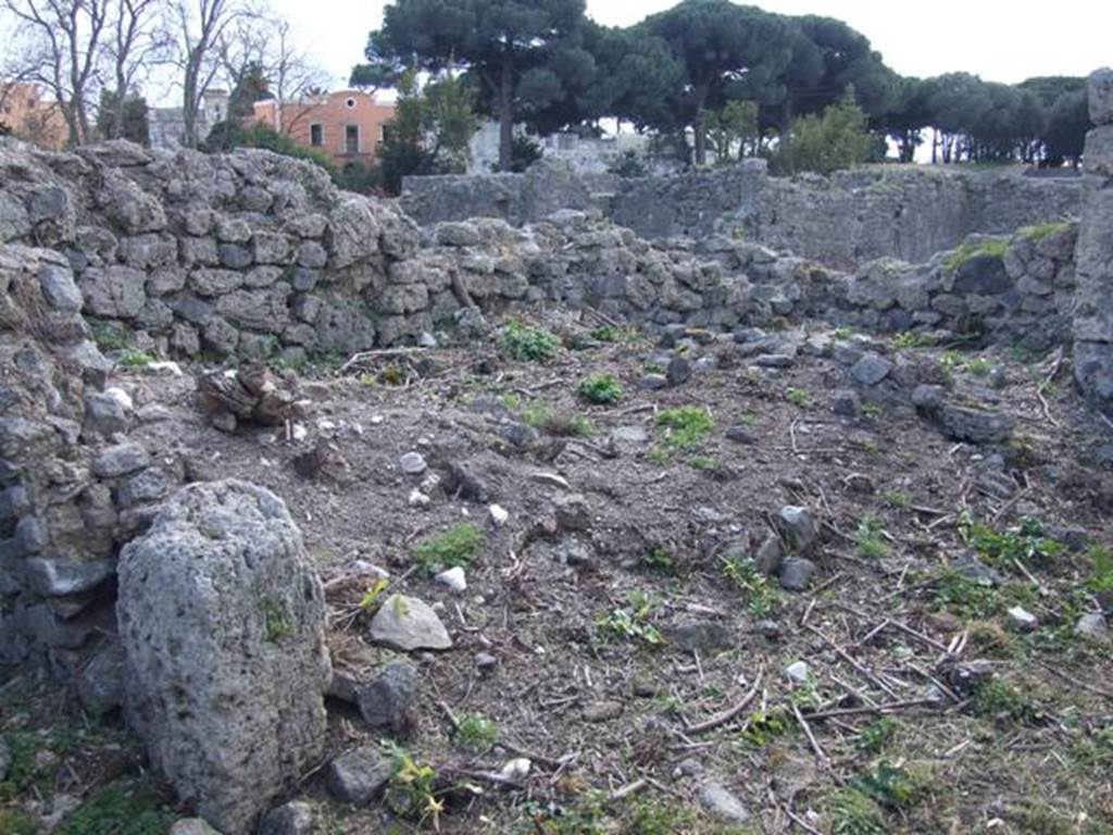 I.2.20 Pompeii.  March 2009. Site of staircase to upper floor, and two small rear rooms in south west corner of garden area.