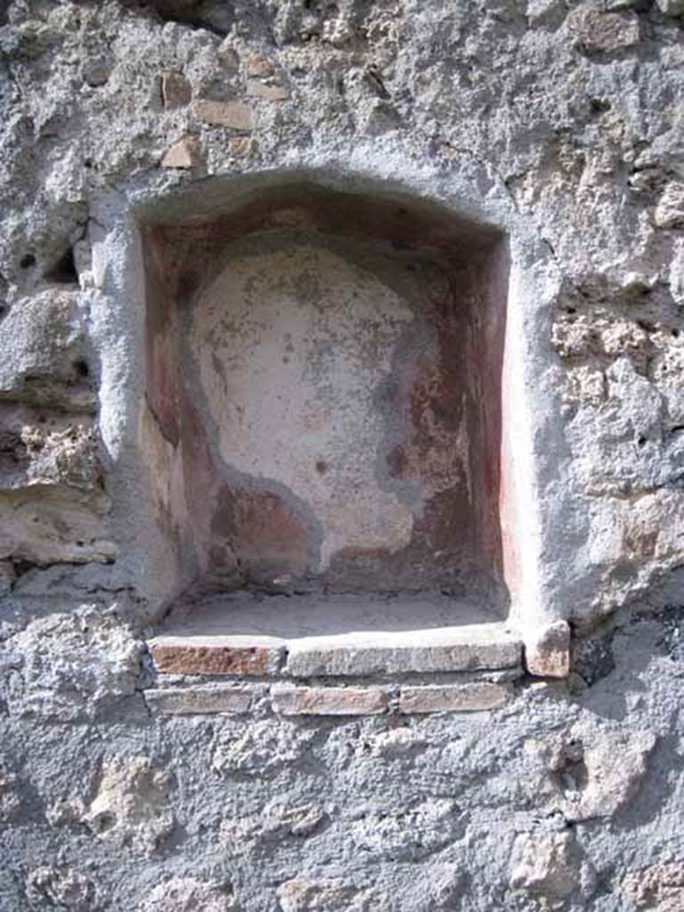 I.2.22 Pompeii. September 2010. Detail of niche on north wall.
Photo courtesy of Drew Baker. Boyce described this as an irregular rectangular niche, with its inside walls painted red. See Boyce G. K., 1937. Corpus of the Lararia of Pompeii. Rome: MAAR 14. (p.23) 
