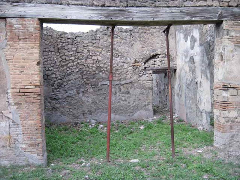 I.2.24 Pompeii. September 2010. North wall of atrium with doorway to large room, looking north. Photo courtesy of Drew Baker.
