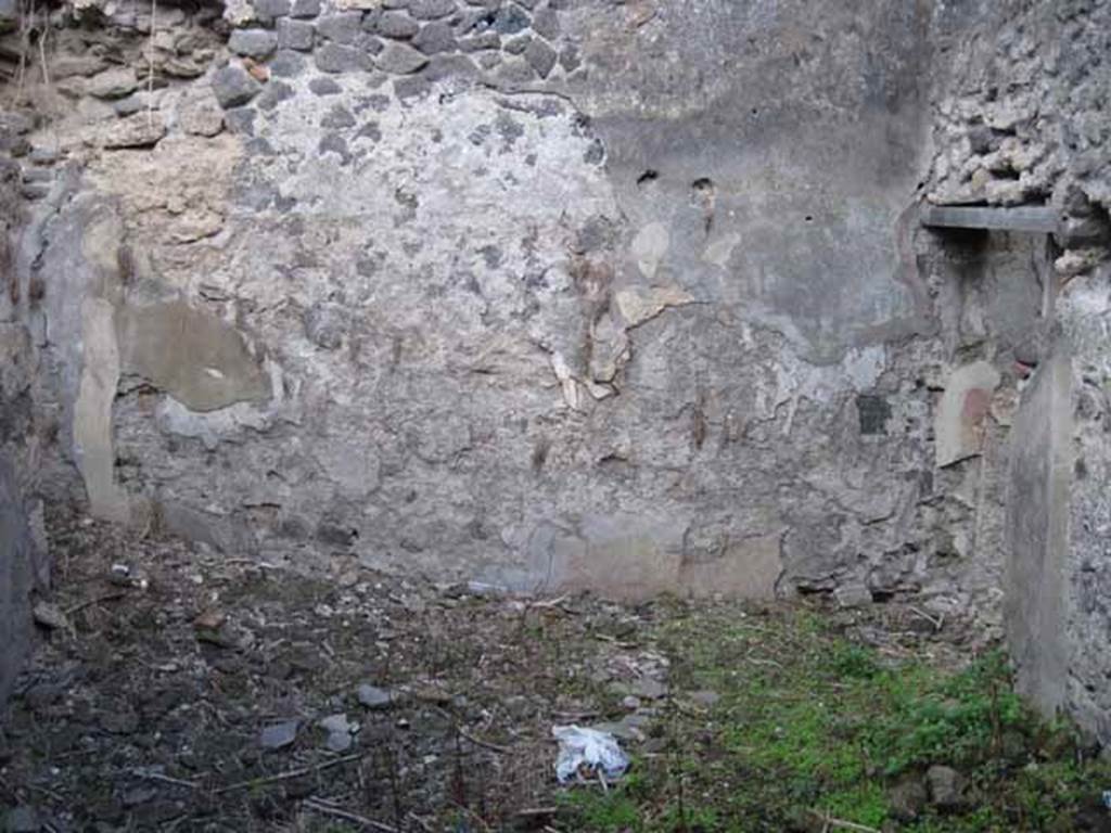 I.2.24 Pompeii. September 2010. East wall, showing doorway to corridor on right. There is a second doorway on the left, leading into another room.
Photo courtesy of Drew Baker.
