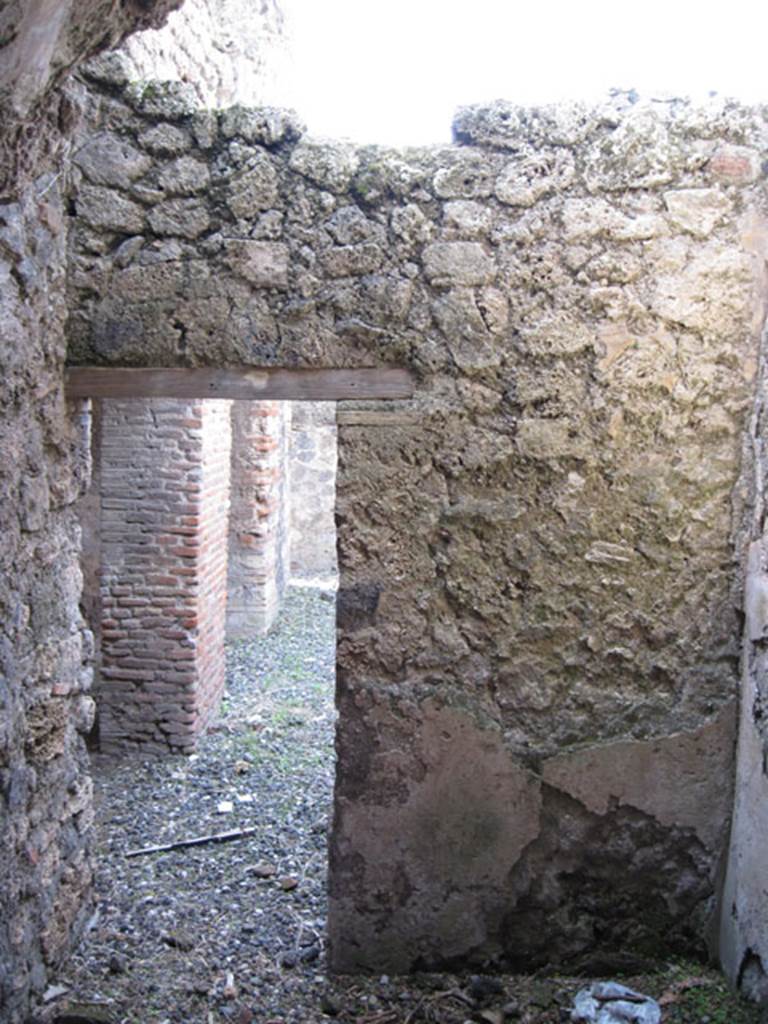 I.3.3 Pompeii. September 2010. West wall of small room, looking through doorway into wider corridor on north side of kitchen doorways. Photo courtesy of Drew Baker.
