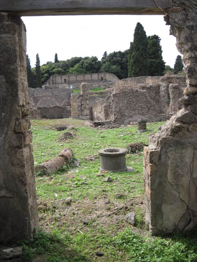 I.3.3 Pompeii. September 2010. Upper peristyle area, looking west through doorway from cubiculum onto east portico.  Photo courtesy of Drew Baker.
