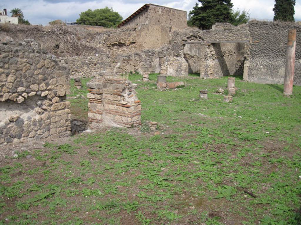 I.3.3 Pompeii. September 2010. Upper peristyle area, north-east corner of large exedra or triclinium, with doorway into collapsed sloping corridor. Photo courtesy of Drew Baker.

