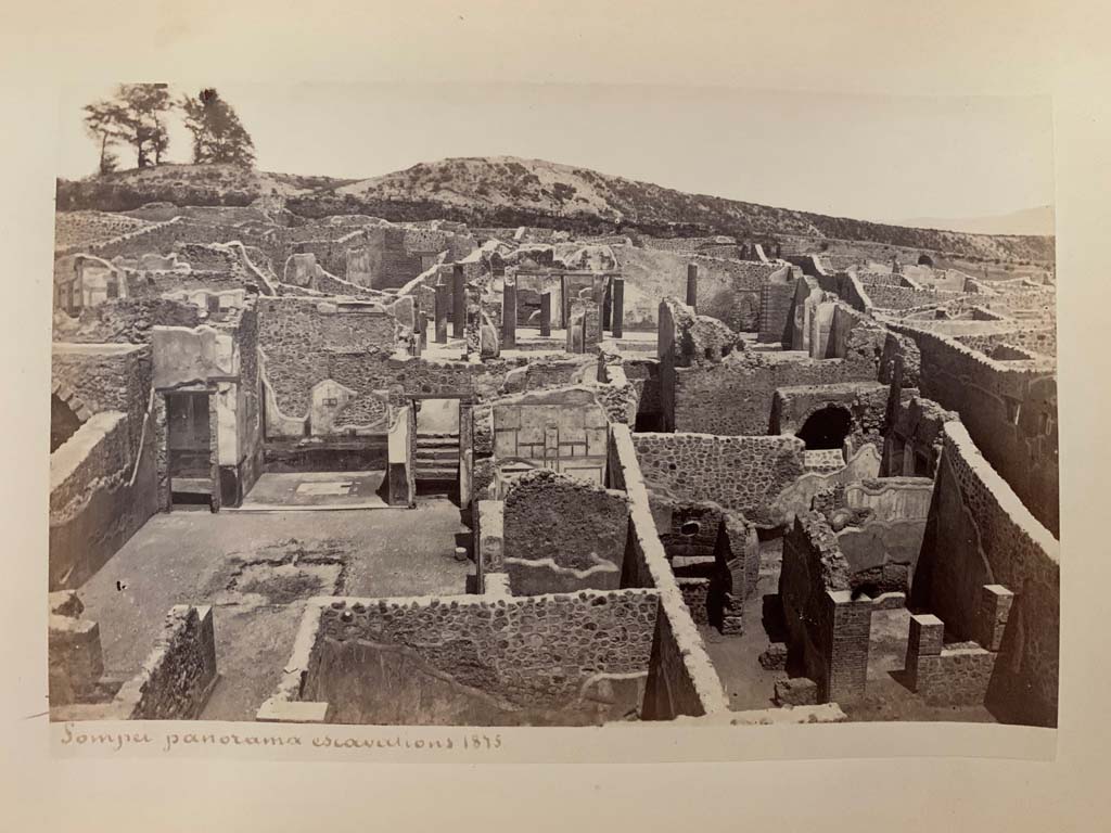 I.3.3 Pompeii. Photograph by M. Amodio, from an album dated April 1878.
Looking east across atrium, on left. The upper peristyle can be seen, centre right.
I.3.1 can be seen in lower right. Photo courtesy of Rick Bauer.
