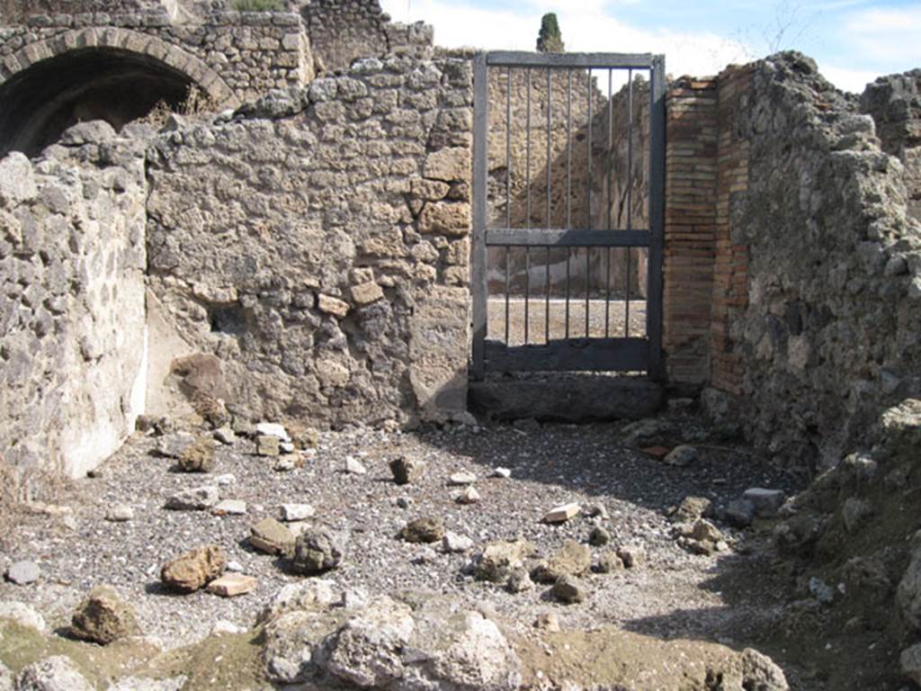 I.3.4 Pompeii. September 2010. Looking towards the eastern wall and doorway into I.3.3, from the entrance doorway. Photo courtesy of Drew Baker.
