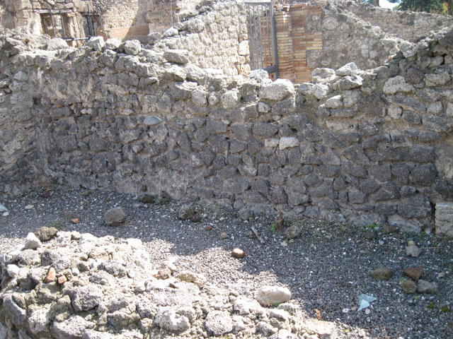 I.3.5 Pompeii. September 2010. Looking east across the north side of the entrance room. Photo courtesy of Drew Baker. At the rear of the entrance room was a doorway to the rear vaulted room. According to Fiorelli, on the right of the doorway above the remains of the wall, a large window allowing light to the rear room was found. 
