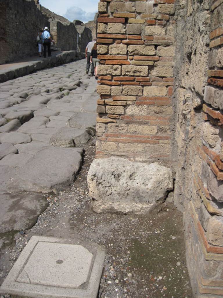 I.3.6 Pompeii. September 2010. Feature on pavement on north side of entrance doorway. Looking north along Via Stabiana, on left. Photo courtesy of Drew Baker.
