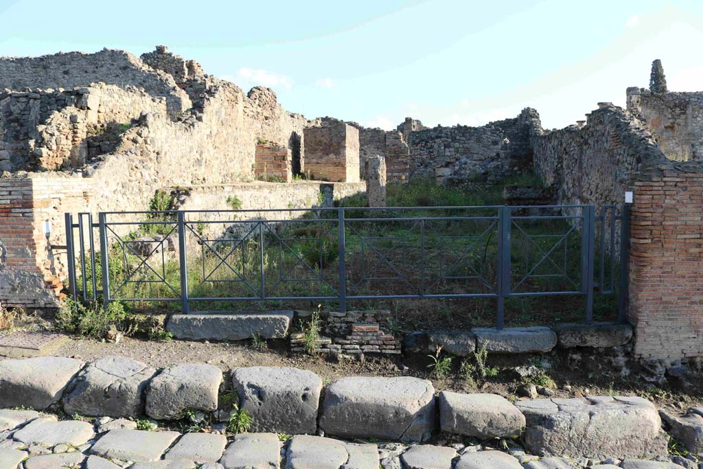 I.3.10 Pompeii, on left. December 2018. 
Two linked doorways on east side of Via Stabiana. I.3.9 entrance to shop, on right. Photo courtesy of Aude Durand.
