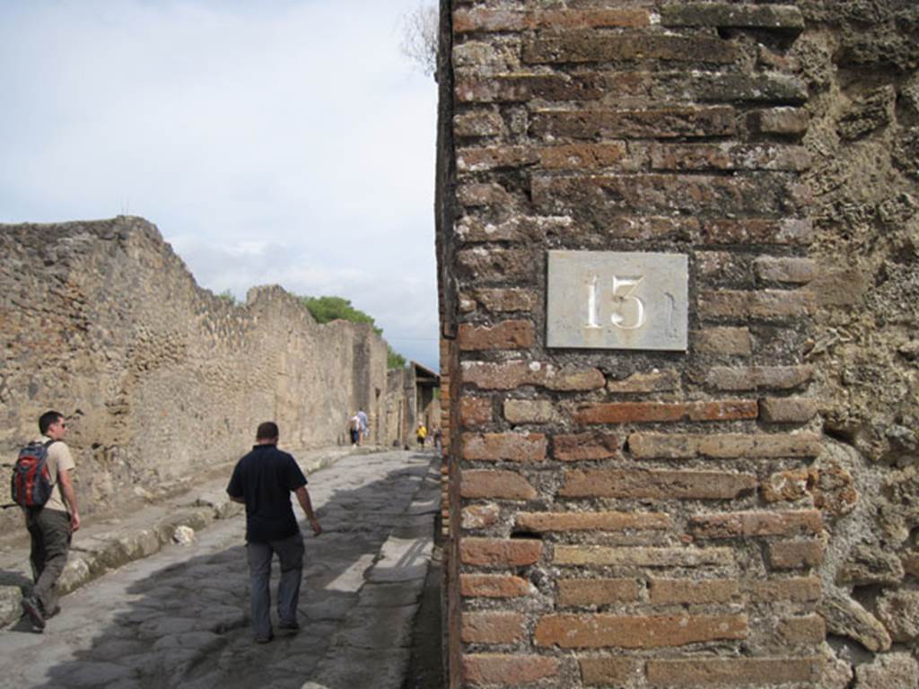 I.3.13 Pompeii. September 2010. Number ID plate. Looking east along Vicolo del Menandro. Photo courtesy of Drew Baker.