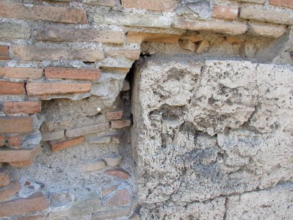 I.3.13 Pompeii. December 2007. Brick and stone to west side of entrance.