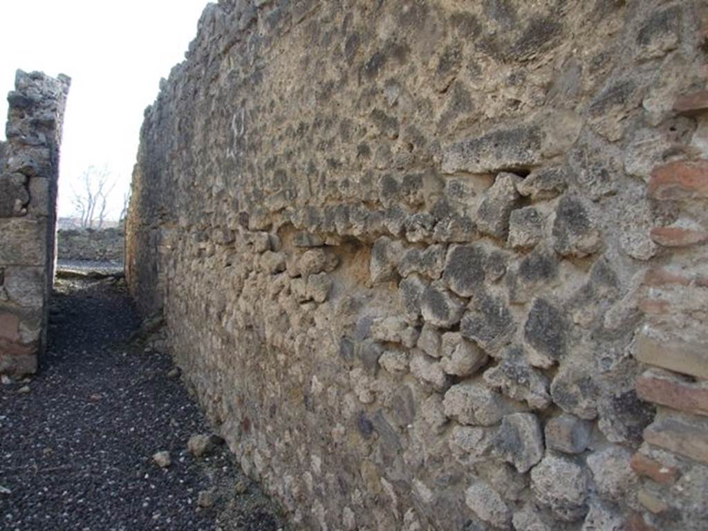 I.3.14 Pompeii. December 2007.  
West wall and corridor to narrow area behind which is shared with I.3.13.

